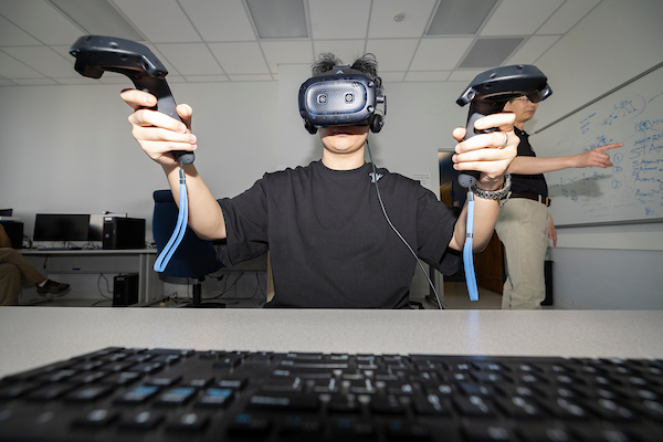 Student working with virtual reality equipment